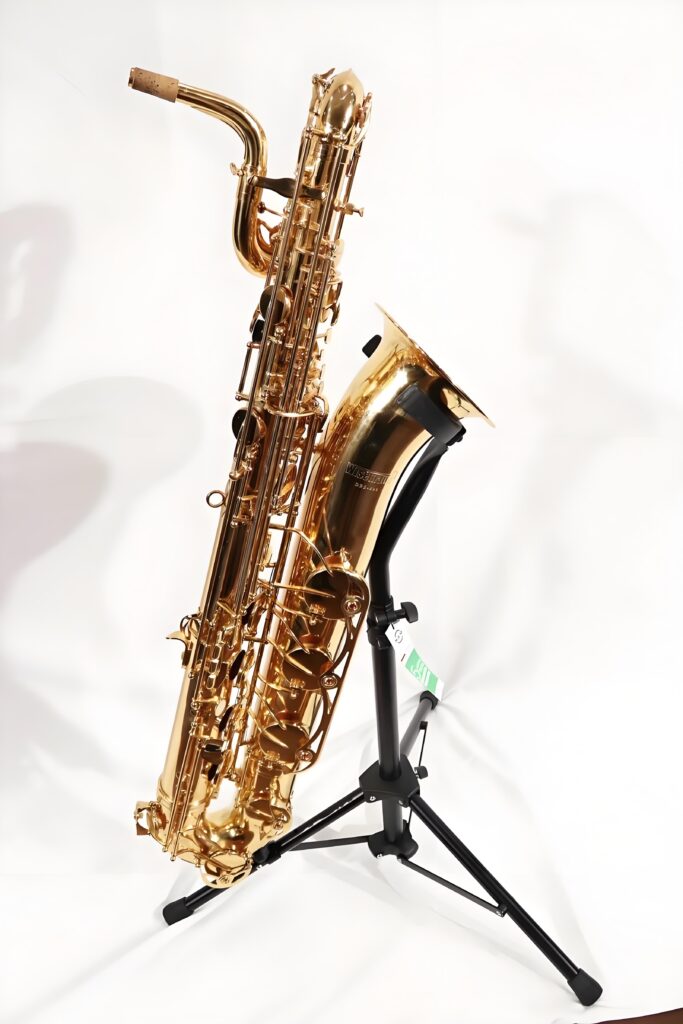 Gold baritone saxophone displayed on a stand